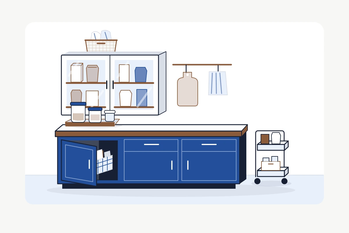 Illustrated small kitchen with a food cupboard, door-back basket, counter tray and cart parked clear of the work area